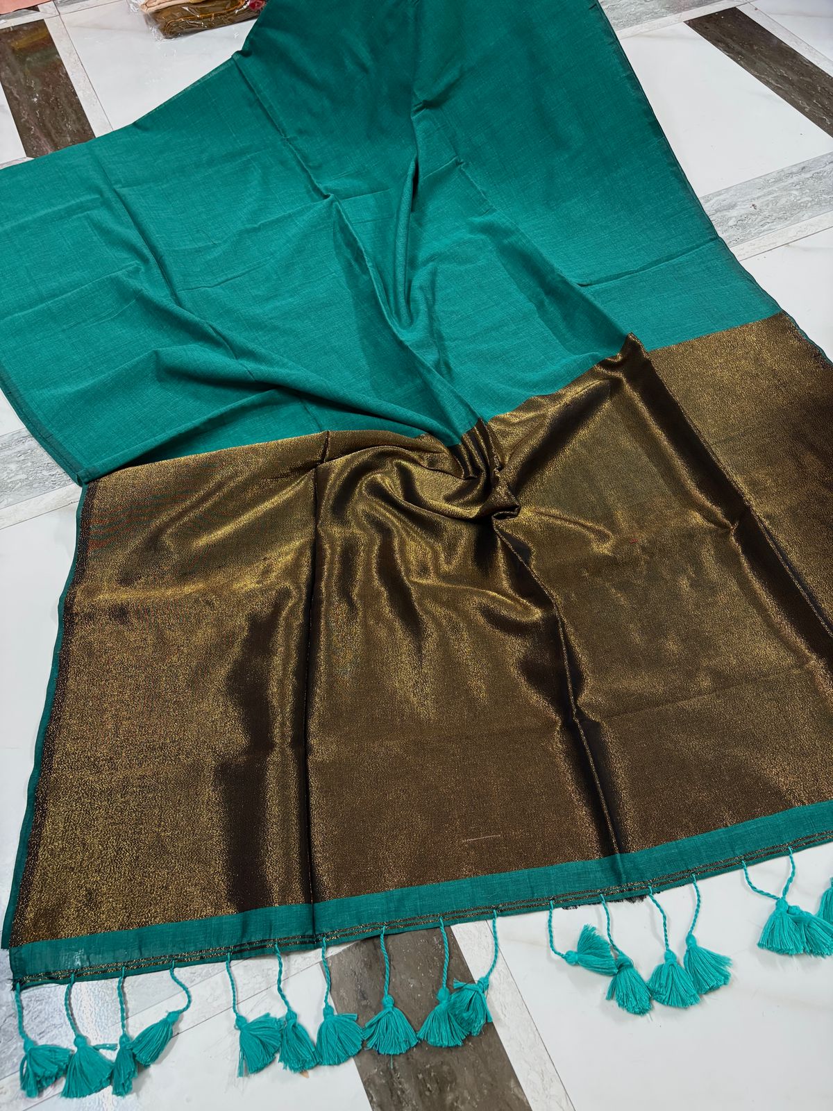 Graceful Light Green Saree with Golden Border and Tassels